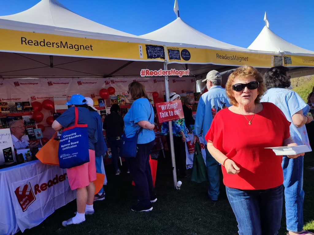 A book fair booth with the name "Readers Magnet" displayed.