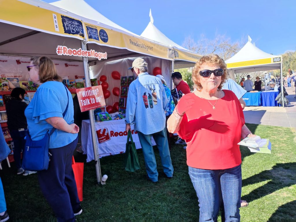 A book fair booth with the name "Readers Magnet" displayed.