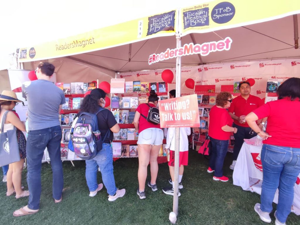 A book fair booth with the name "Readers Magnet" displayed.