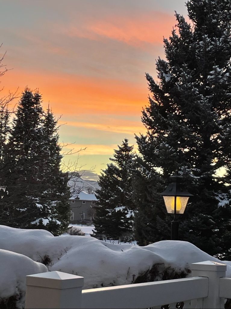 A colorful sunset over a snowy landscape