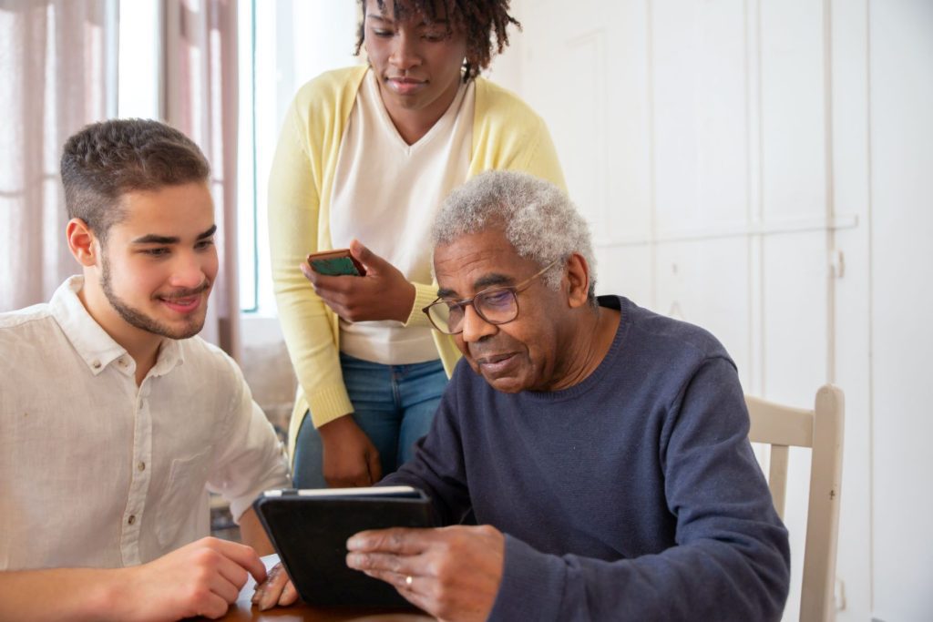Assisted Living After Retirement two caregivers attending an elderly man