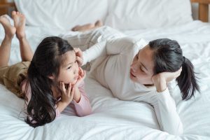 woman talking to a child about hospice care