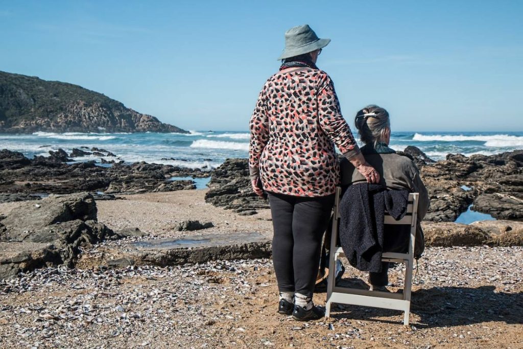 elderly women looking at the sea avoiding ableism and toxic positivity