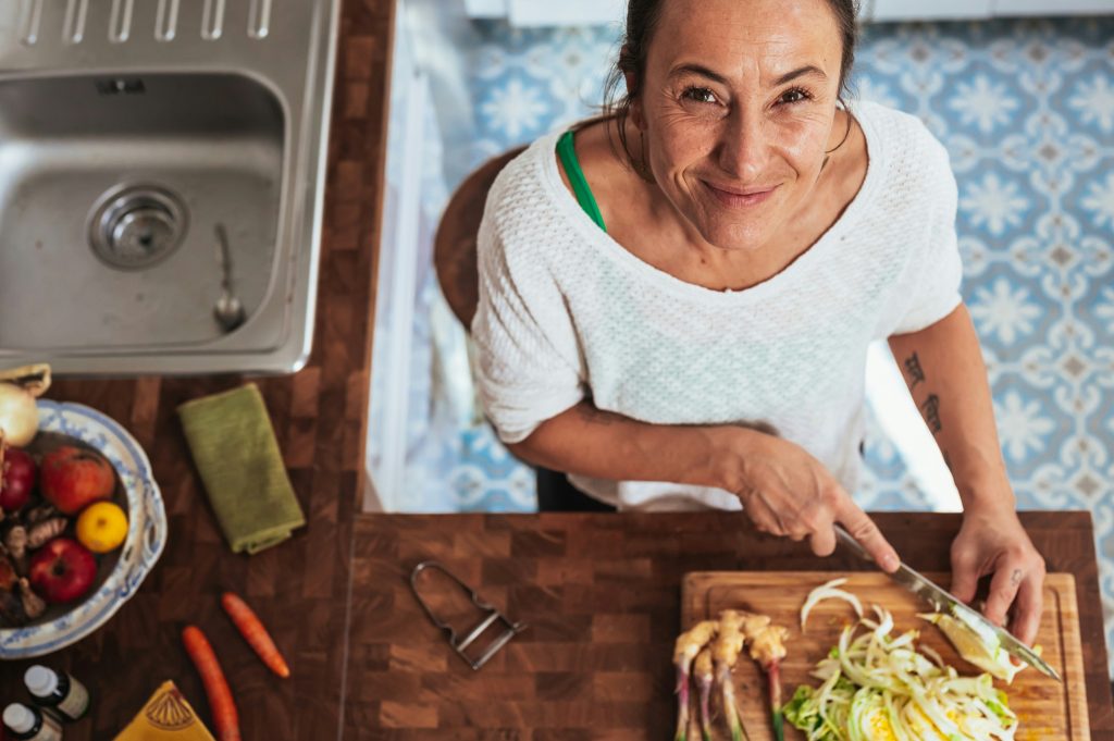 A woman falling in love with cooking.