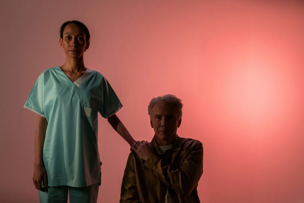 a photo of a man holding his caregiver’s hand reflecting post-caregiving syndrome