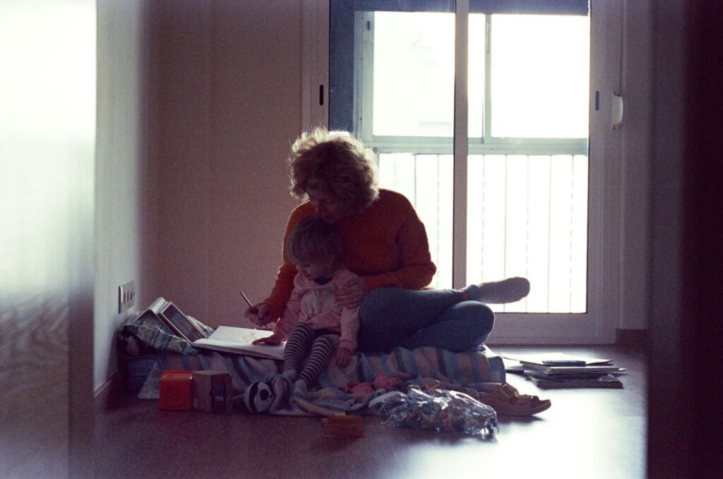 a photo of a woman with a child practicing ways to avoid empathy burnout as a caregiver