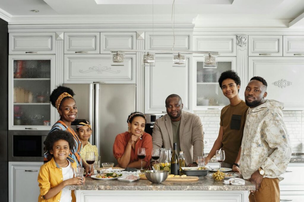 A family preparing food in the kitchen.