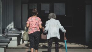 Caregiver Helping Elderly Walk