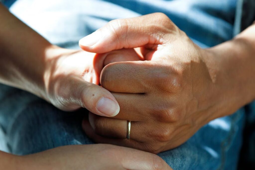 Person Holding Another’s Hand