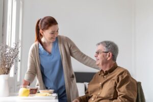 man smiling with female caregiver