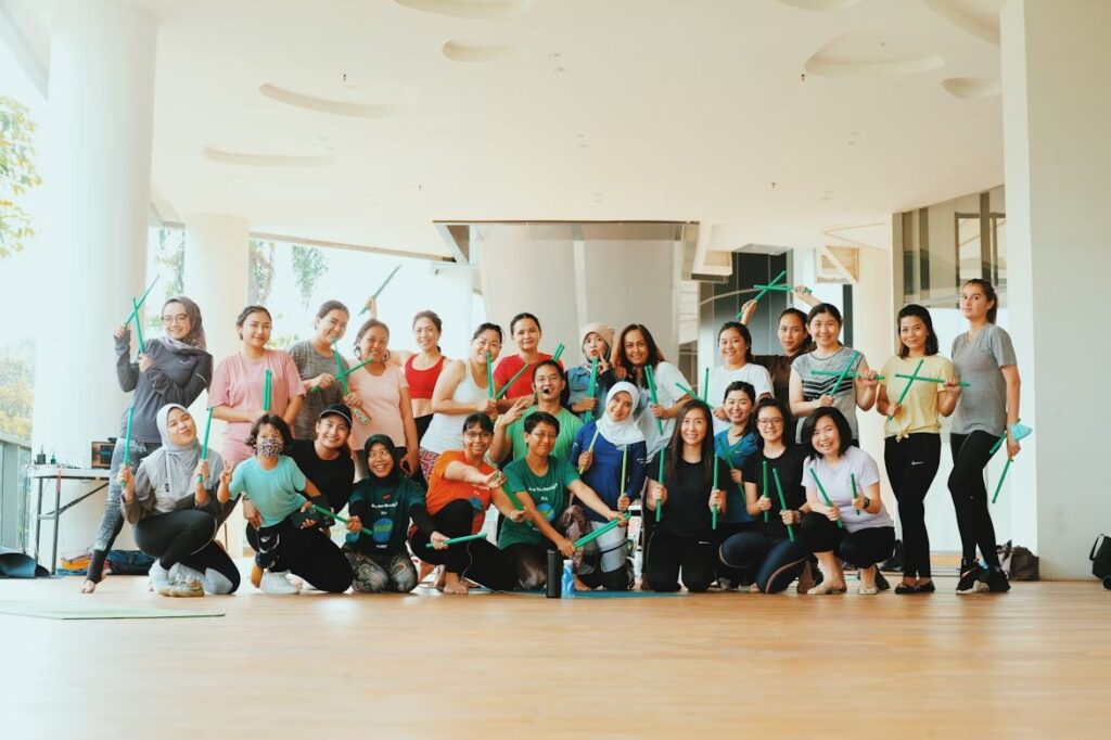 Team of Caregivers Posing With Their Patients