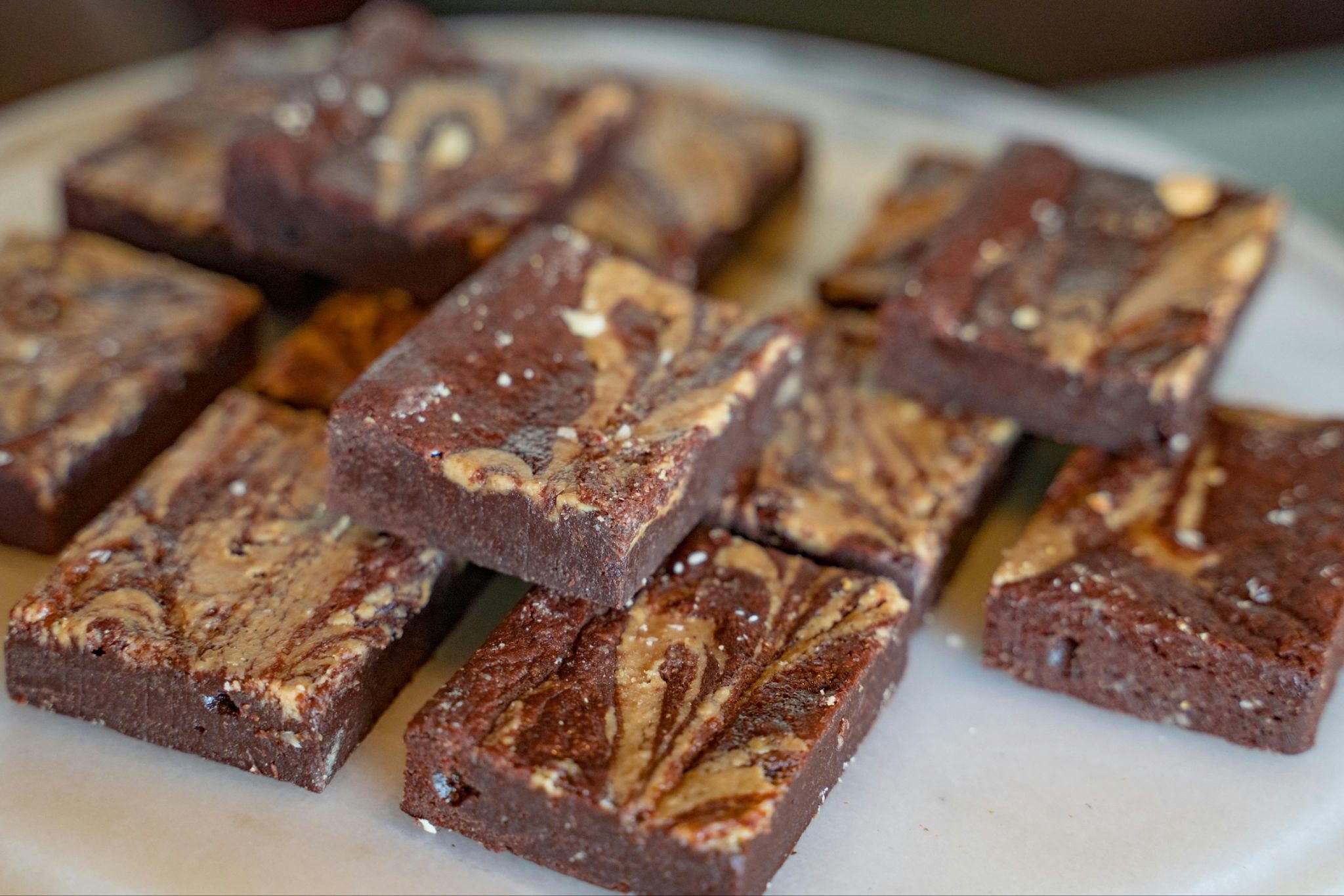 A swirl tiger butter fudge treat on a plate.