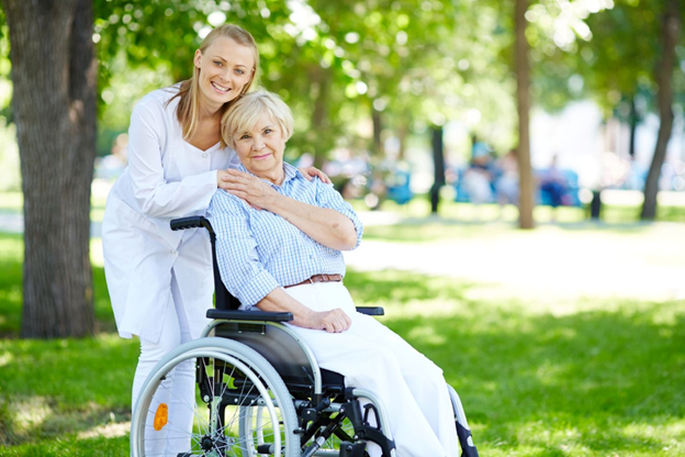A woman in a wheelchair and her daughter, who is her caregiver.