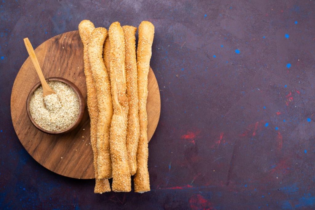 A stack of sugarcoated breadsticks.