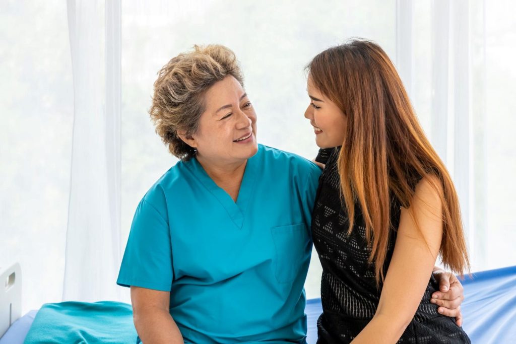 Young caregiver visiting elderly patient.