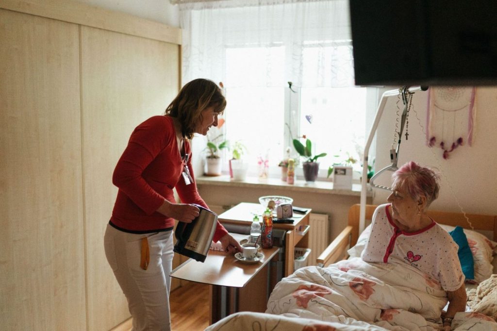 A family caregiver taking care of her charge.