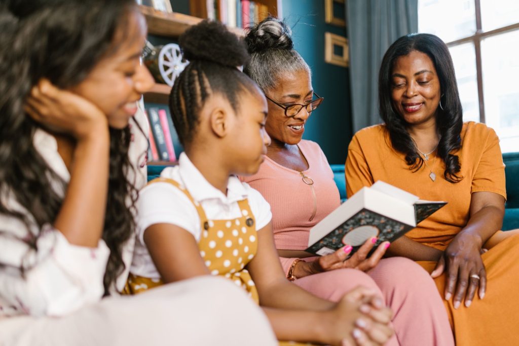 A family reading together, reflecting family conversations inspired by caregiving decision making books.