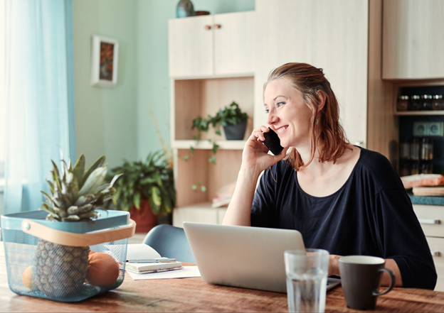 Family caregiver working on a laptop while learning about financial protections and caregiver support.